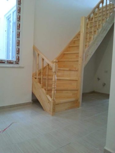 a wooden staircase in a room